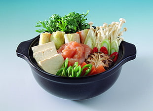 black ceramic pot with salad